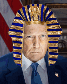 a man in a suit and tie is wearing a pharaoh costume