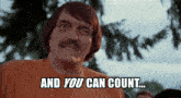 a man with a mustache is wearing an orange shirt that says and you can count