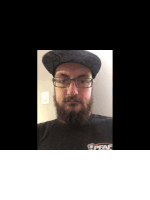a man with a beard wearing glasses and a black shirt that says gdfaf