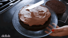 spreading chocolate icing chocolate cake desert baking
