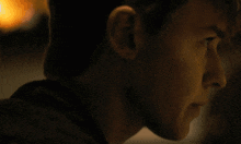 a blurry picture of a person 's face with a light behind them