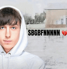 a boy wearing a white hoodie with sbgbfnnnn written on the front