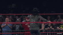 a wrestler wearing a mask and a hat with one on it