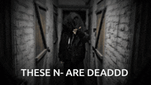 a black and white photo of a person in a hallway with the words these n-are deaddd