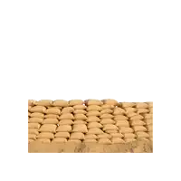 a man in a trench coat is crawling over sandbags