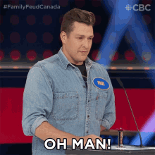 a man with a name tag that says paul stands in front of a microphone
