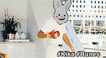 a man wearing a bunny mask with the hashtag # kika # runes on the bottom right