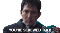 a man in a suit and tie is holding a green shirt that says 450 on it