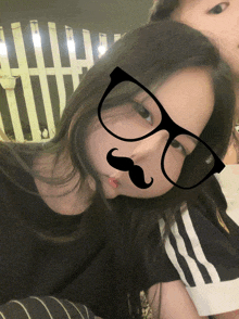 a woman wearing glasses and a fake mustache