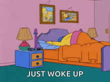 a cartoon of homer simpson in bed with the words just woke up below him