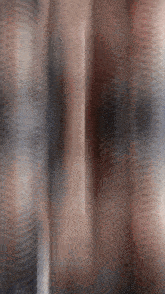 a blurry picture of a person 's face with a red white and blue striped background