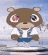 a brown teddy bear with big eyes and a white shirt is standing on a white surface .