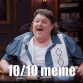 a man is sitting at a table with a 10/10 meme written on the screen