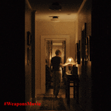 a poster for the weapons movie shows a person walking down a hallway