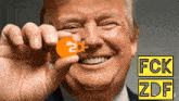 donald trump is smiling and holding a 2df key