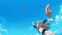 a woman throws a hat in the air while a plane flies in the background