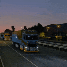 a volvo truck is driving on a highway at night