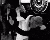 a bride and groom are dancing together at a wedding reception .