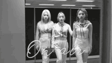 a black and white photo of three women standing next to each other with on air written on the bottom right