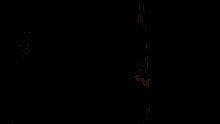 a silhouette of a person standing in front of a yellow wall