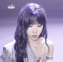 a woman with purple hair is wearing a headband and a denim jacket