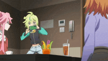 a girl taking a picture of another girl in a room