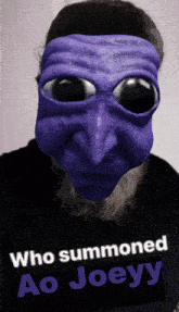 a man with a beard wearing a purple mask with the words who summoned ao joeyy