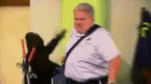 Beating Up Jerry GIF - Parks And Rec Jerry Gergich Jim O Heir GIFs