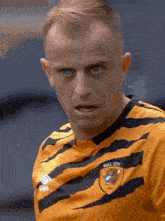 a man in a hill city jersey looks at the camera