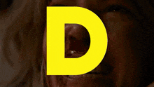 a yellow letter r is displayed on a car windshield