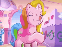 a pink pony with a yellow mane is standing in front of a purple dresser