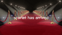 a red carpet with the words scarlet has arrived written on it