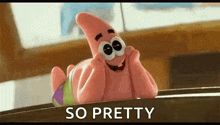 patrick star from spongebob squarepants is laying on a table with his hands on his chin .