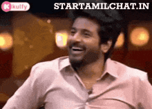 a man in a white shirt is laughing with the words starttamilchat.in behind him