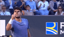 a man in a blue shirt with the number 9 on it