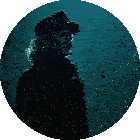 a woman wearing a hat and a black coat is smiling in a dark circle
