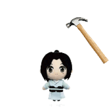 a stuffed doll is holding a hammer in front of it .