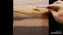 a person is painting a landscape on a canvas with a brush
