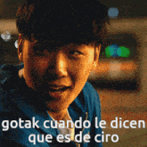 a close up of a man 's face with the words gotak cuando le dicen que es de ciro above him