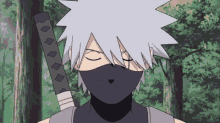 a close up of a person wearing a mask and holding a sword .