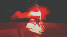 a photo of a man holding a torch that says the maw on the bottom