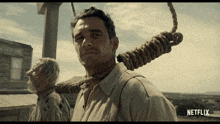 a man with a rope around his neck and the word netflix below him
