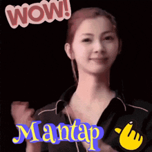 a woman 's face is displayed with the words wow mantap above her