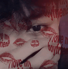 a close up of a woman 's face with the words love my boyfriend written on her face