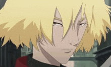 a close up of a person with yellow hair