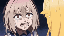 a girl with a dirty face is crying next to a blonde girl