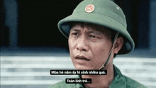 a man wearing a helmet and a military uniform is crying .