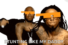two men wearing sunglasses are standing next to each other and one of them says stunting like my daddy .
