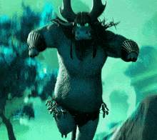 a blue monster with horns and a necklace around his neck