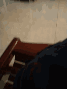 a blurred image of a person sitting in a chair